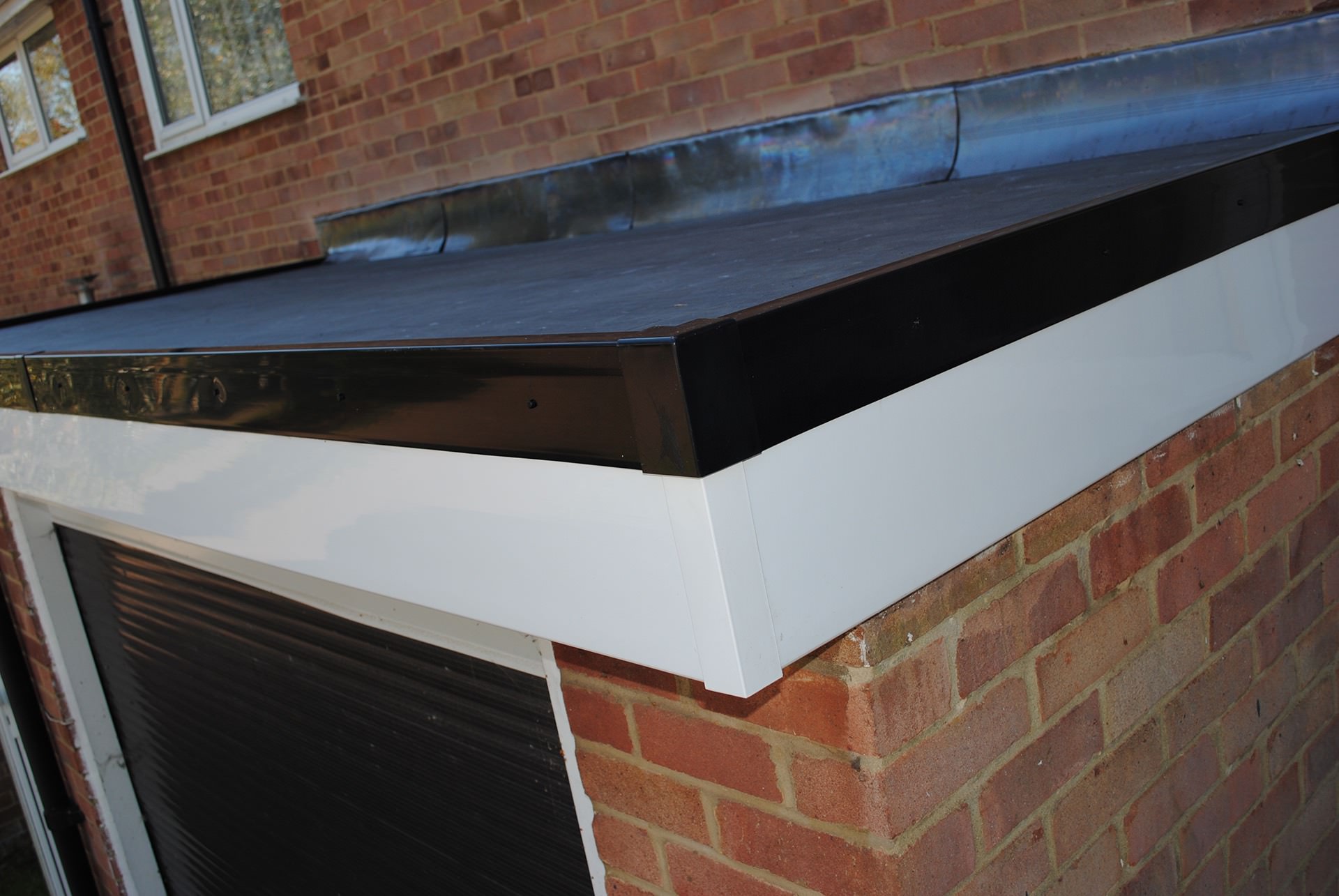 Close-up of a neatly finished roofline and fascia detail